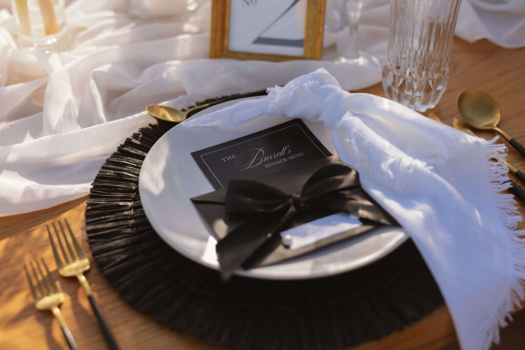 Black and white place setting detail at a Casa Mariposa Villa wedding reception